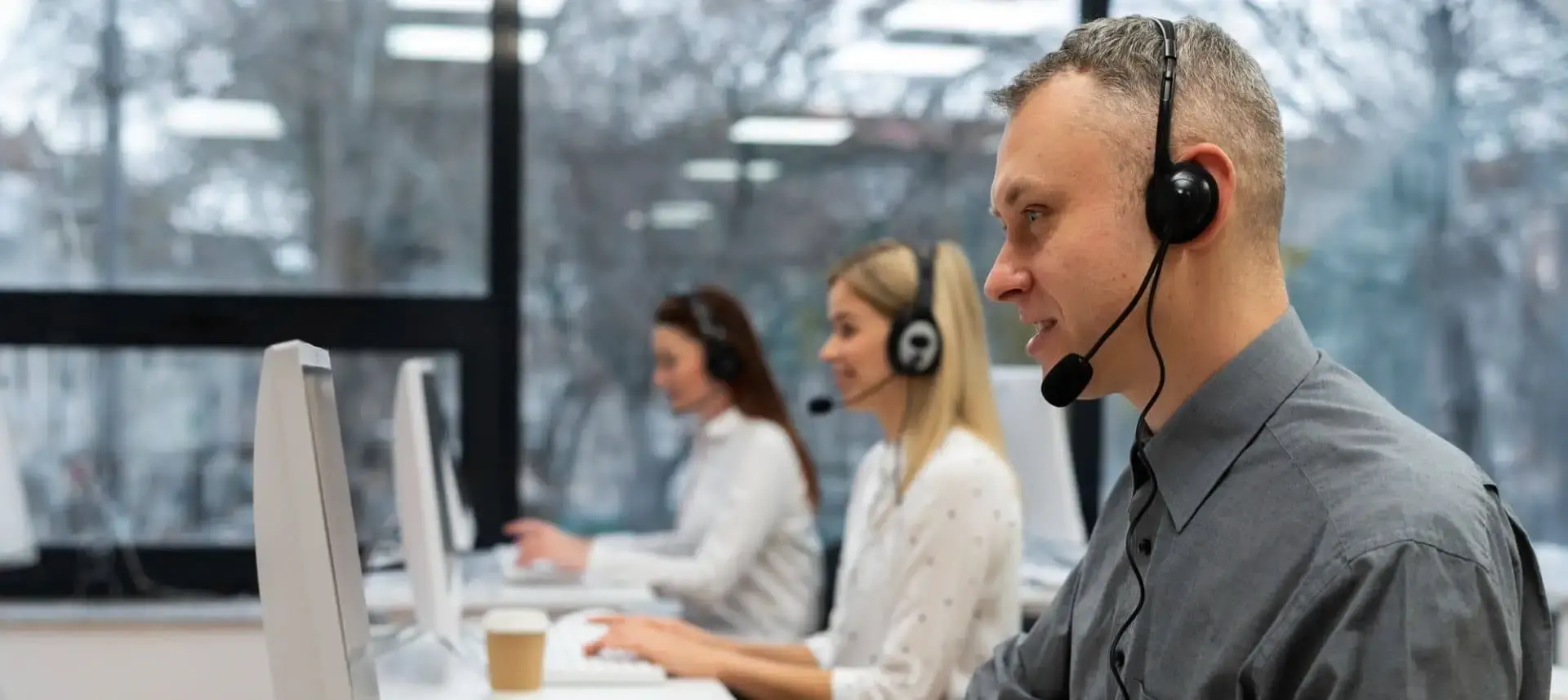 Customer support team wearing headsets.