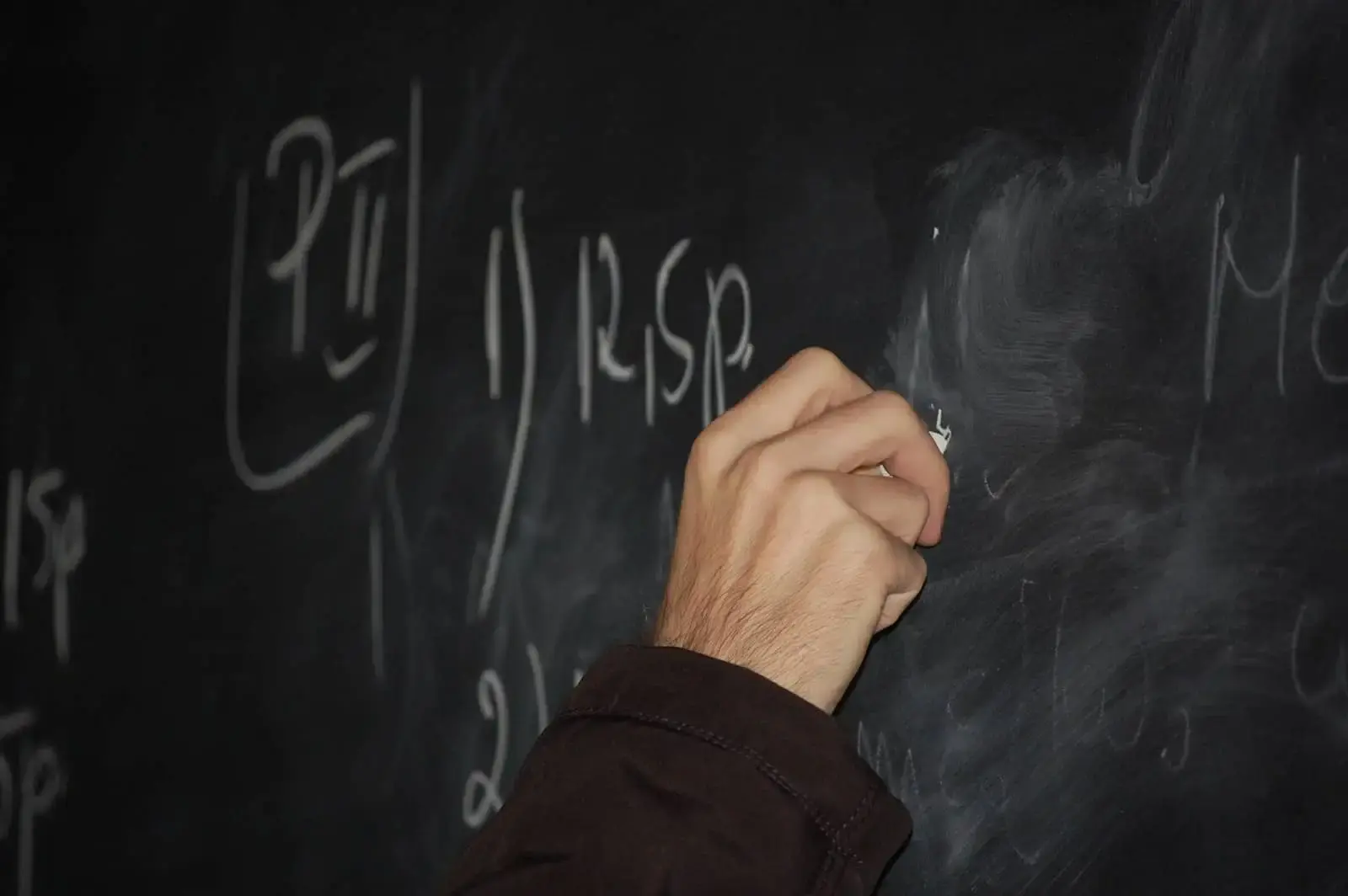 Hand writing on a chalkboard